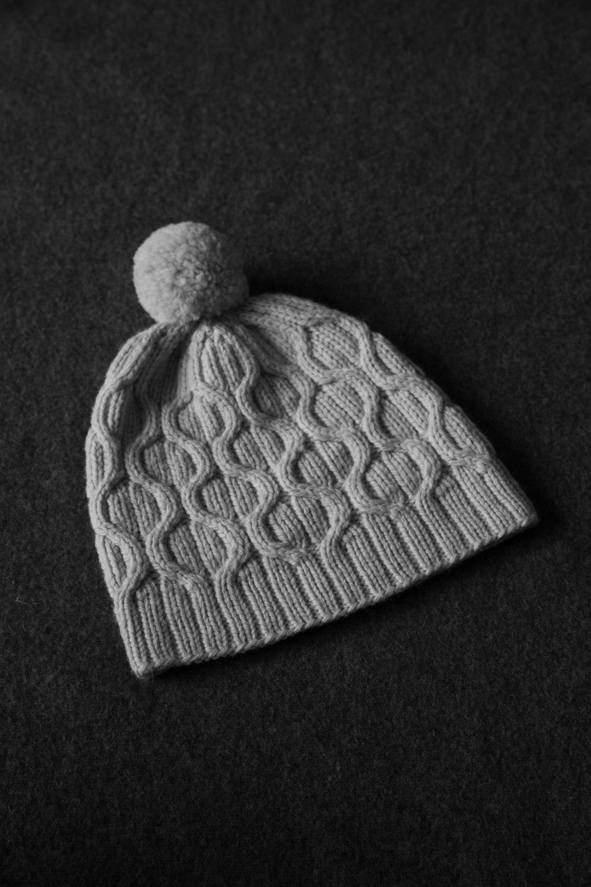 DK weight one color hat with modern cables by Tin Can Knits- perfect for our tunis, Farm Friends and Cormo DK yarns. Uses 100-240 yards depending on size