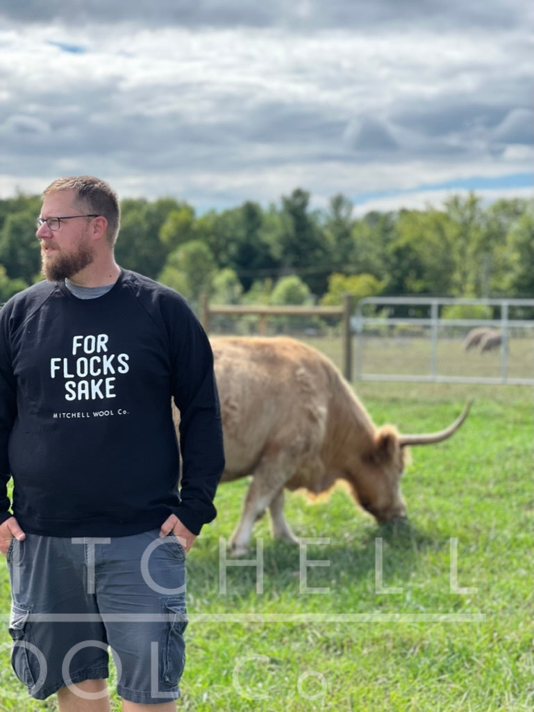 Luke looks off at the calves beyond the camera, always working, even when we stick a new sweatshirt on him.
