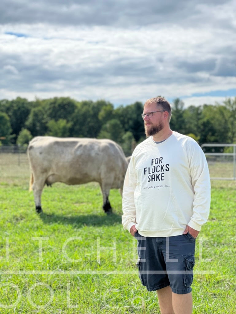 Luke, wearing a natural white organic cotton sweatshirt in size 3xl