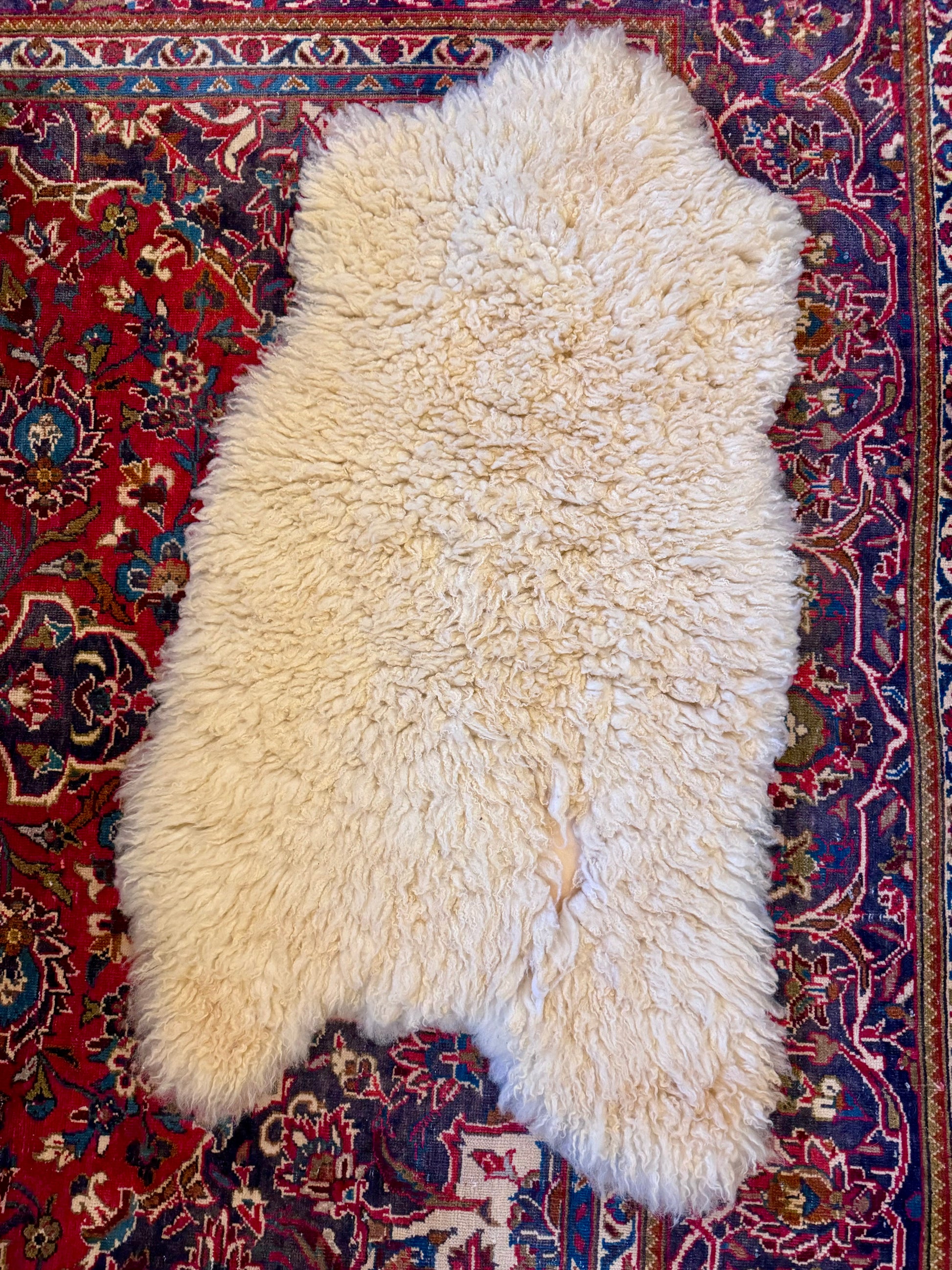 PELT G - has a little bald spot where leather shows through. Natural characteristic of a real pelt. 