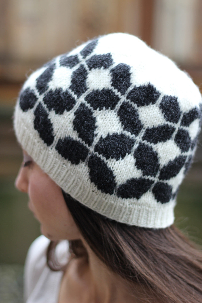 A two skein hat pattern in DK weight designed by Jenny Faifel. We knit ours in Natural cream and brown cormo