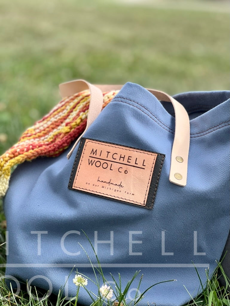 Cornflower blue twill tote with our campfire yarn