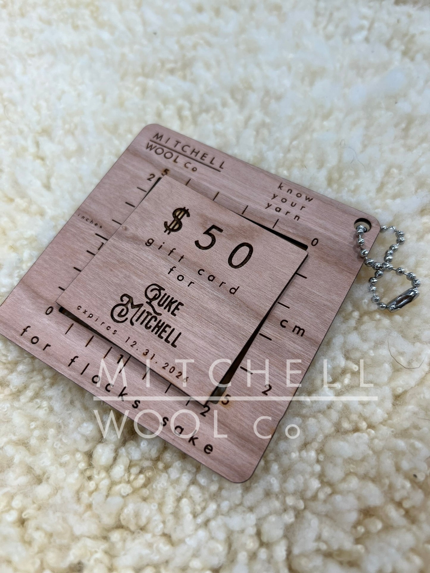 Our laser cut gift card sits on a lambswool pelt.