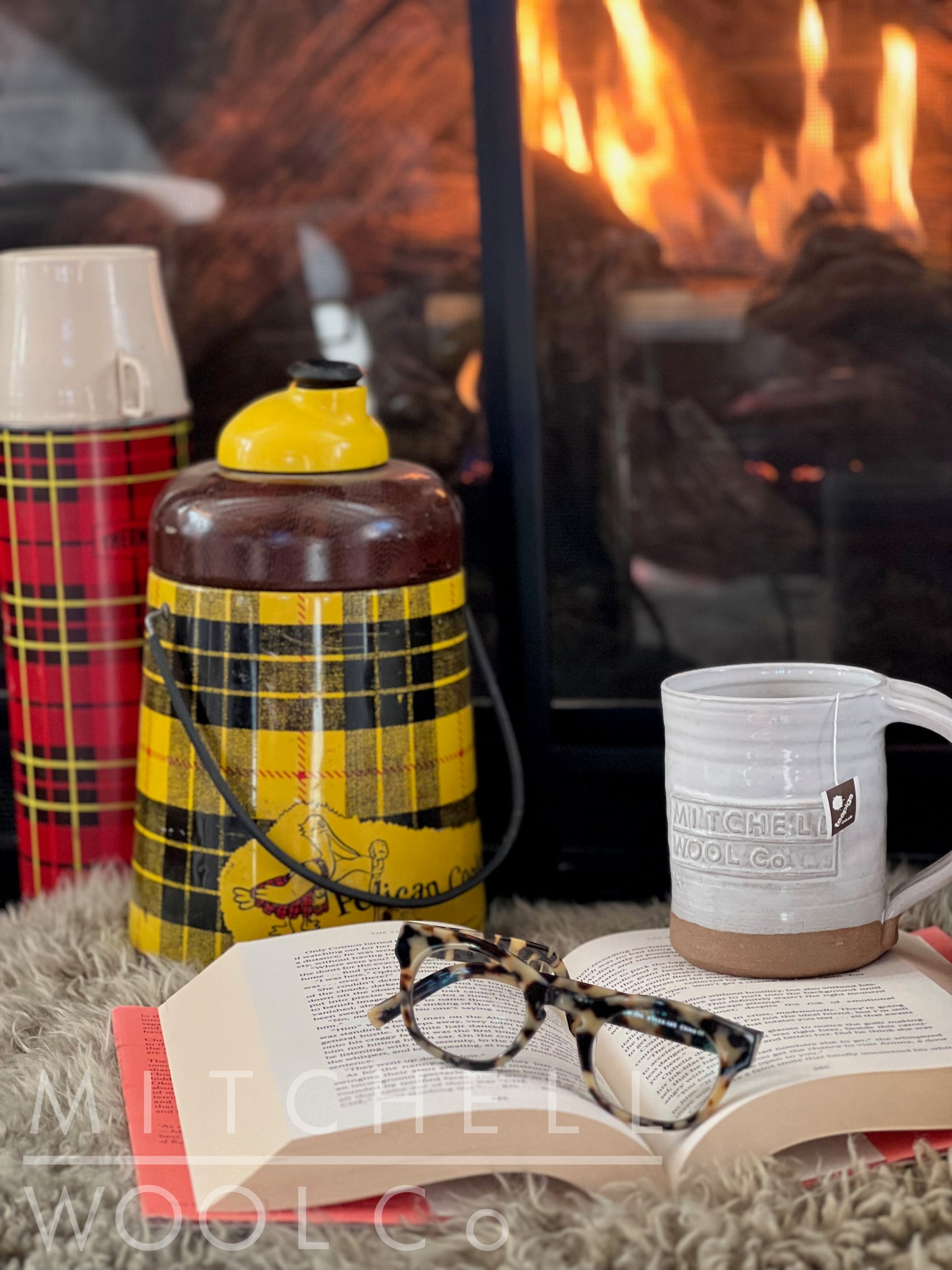 Cozy. Sherry's tossed reading glasses sit atop the book she left to grab more hot water to refill the cup of tea in our beautiful hand thrown coffee mug.