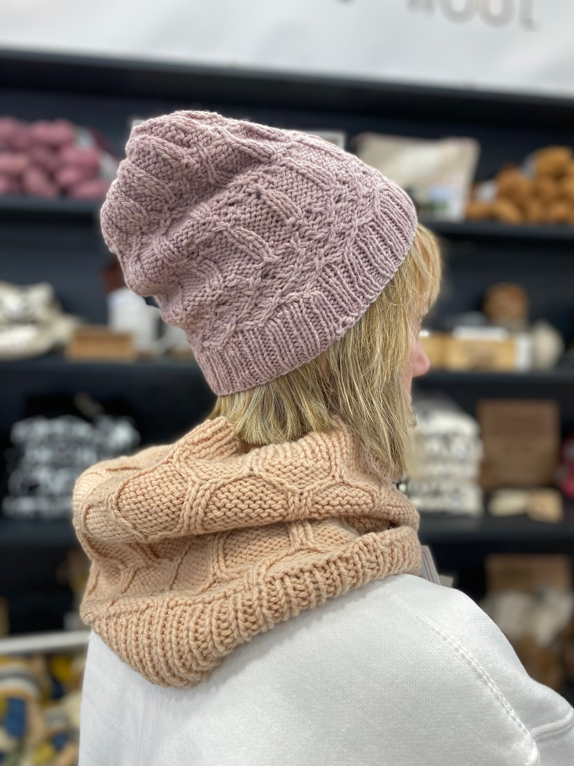 Sherry wears the Chapel House hat knit in our cormo DK Lac and the apiary cowl knit in our avocado. 