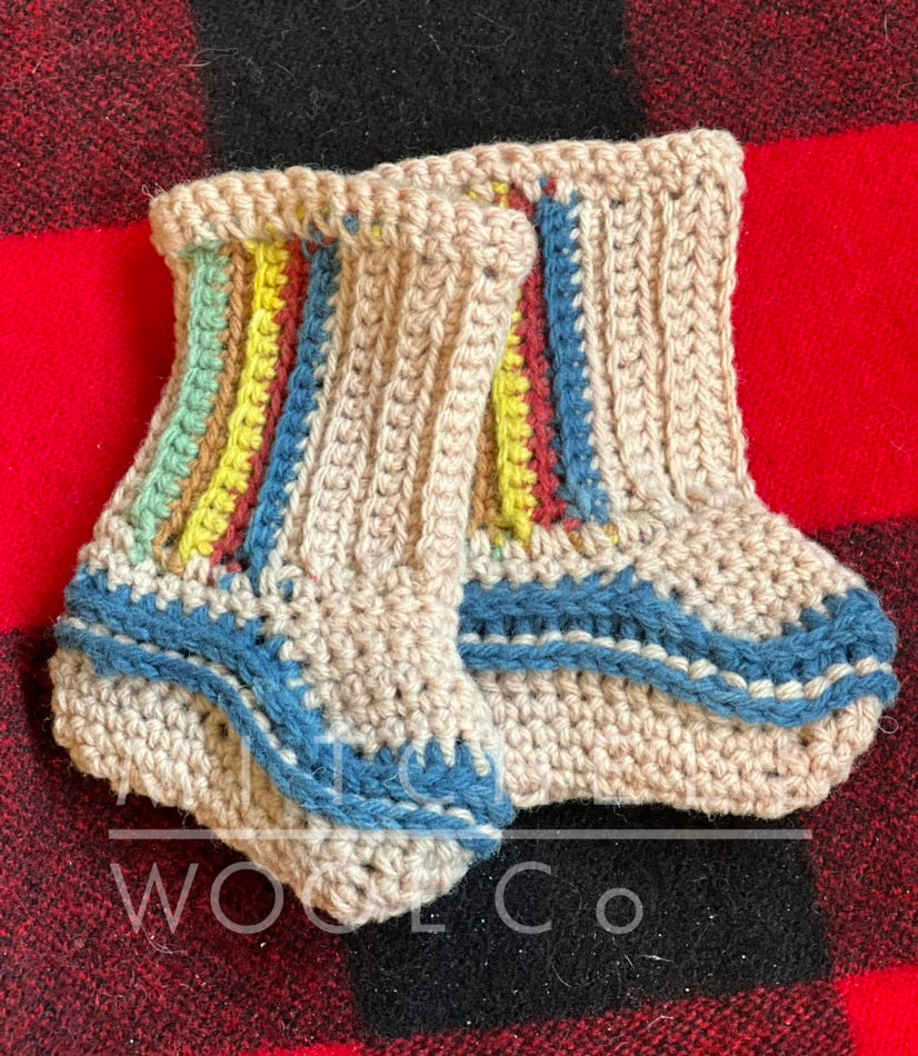 Avocado pink booties with rainbow accents hand crocheted in our cormo dk yarn